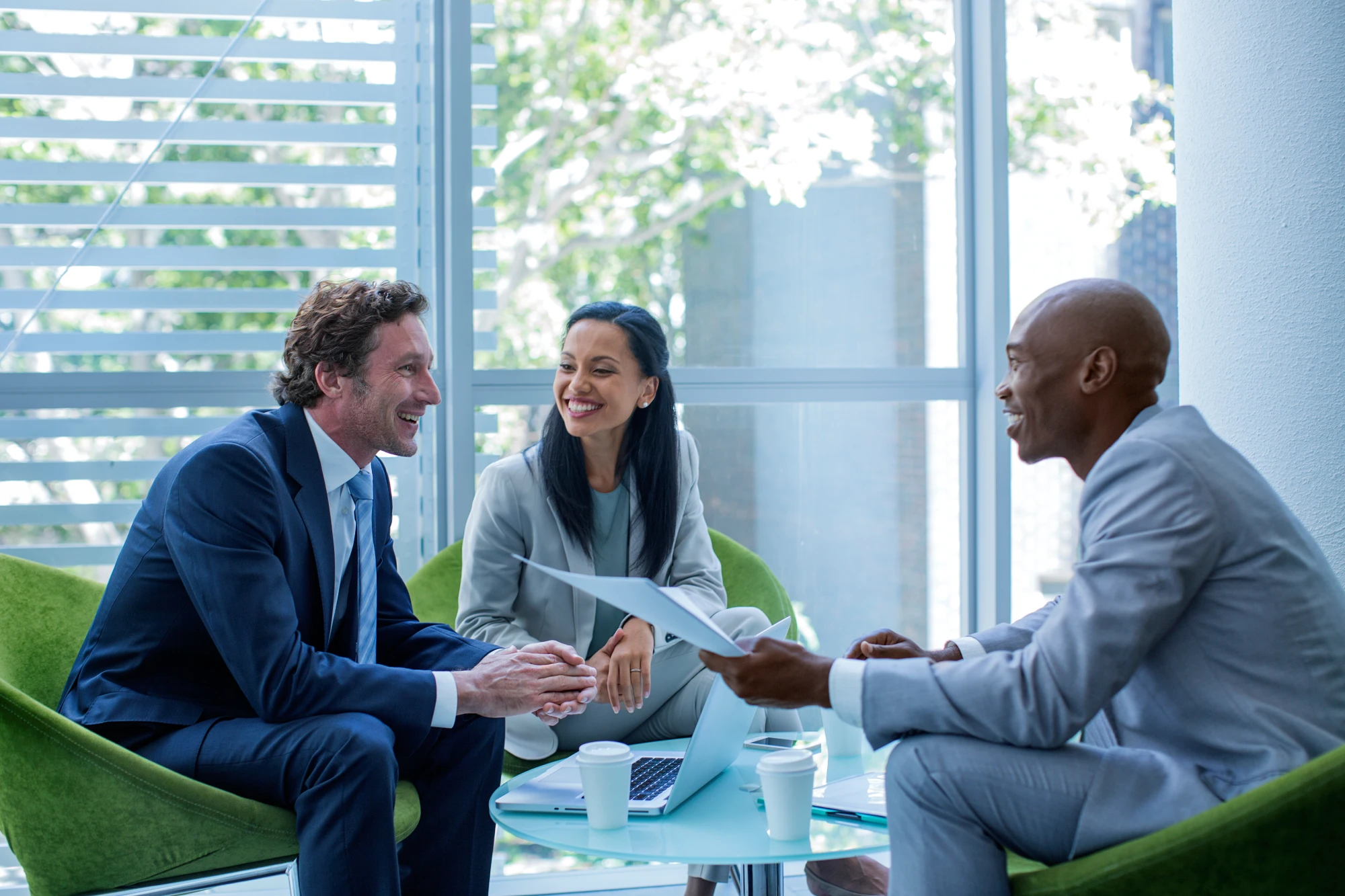 Business people discussing systems management at a table