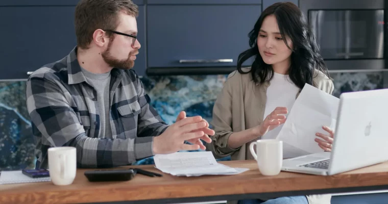 man and woman discussing how to claim tax back